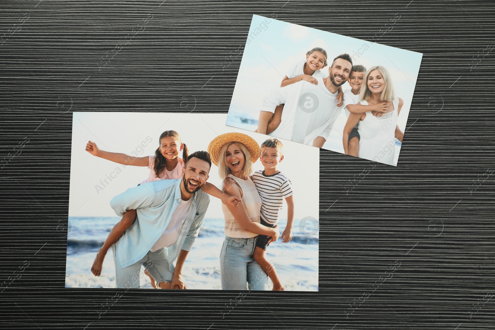 Photo of Different photos on black wooden table, flat lay