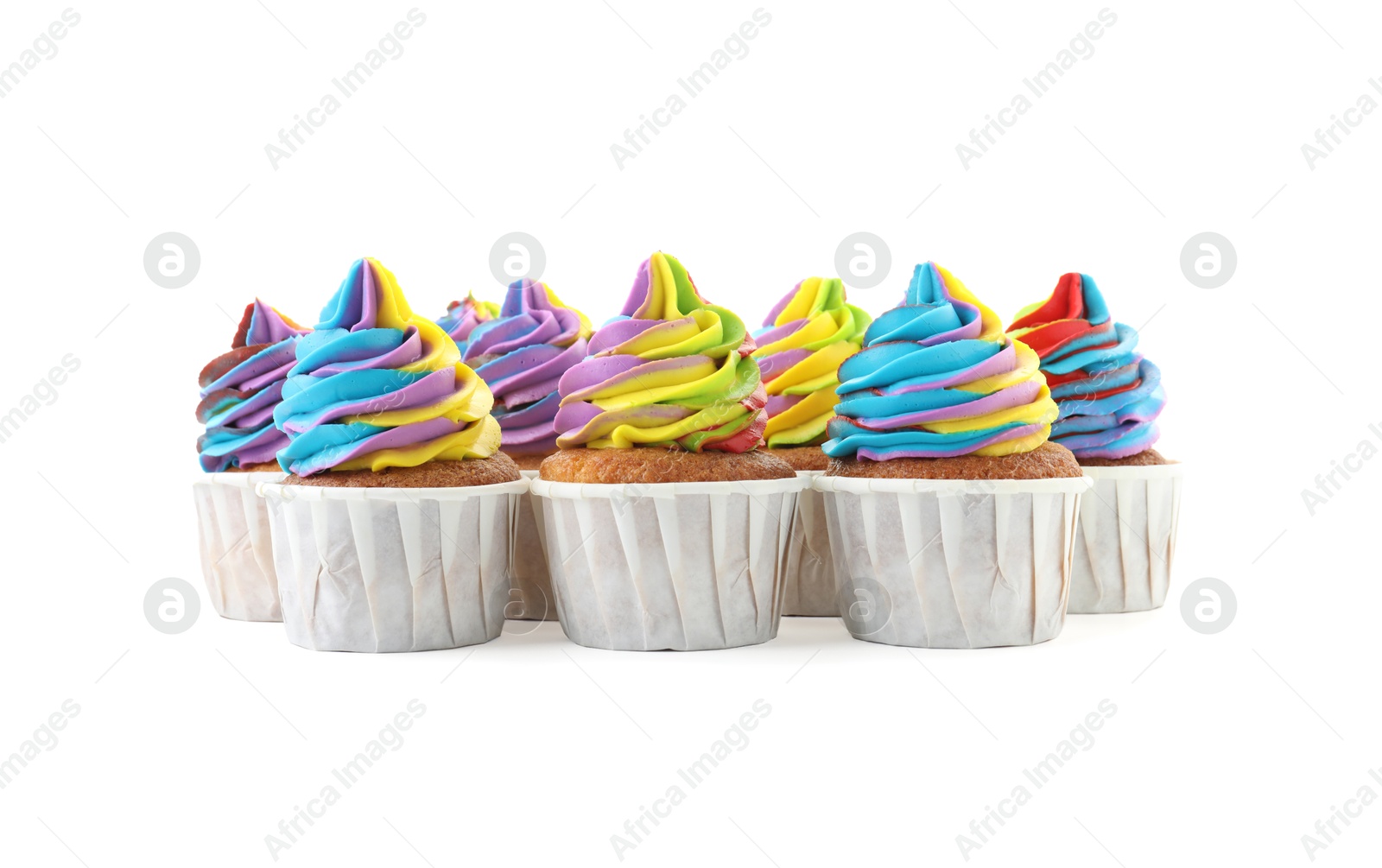 Photo of Tasty cupcakes with colorful cream isolated on white