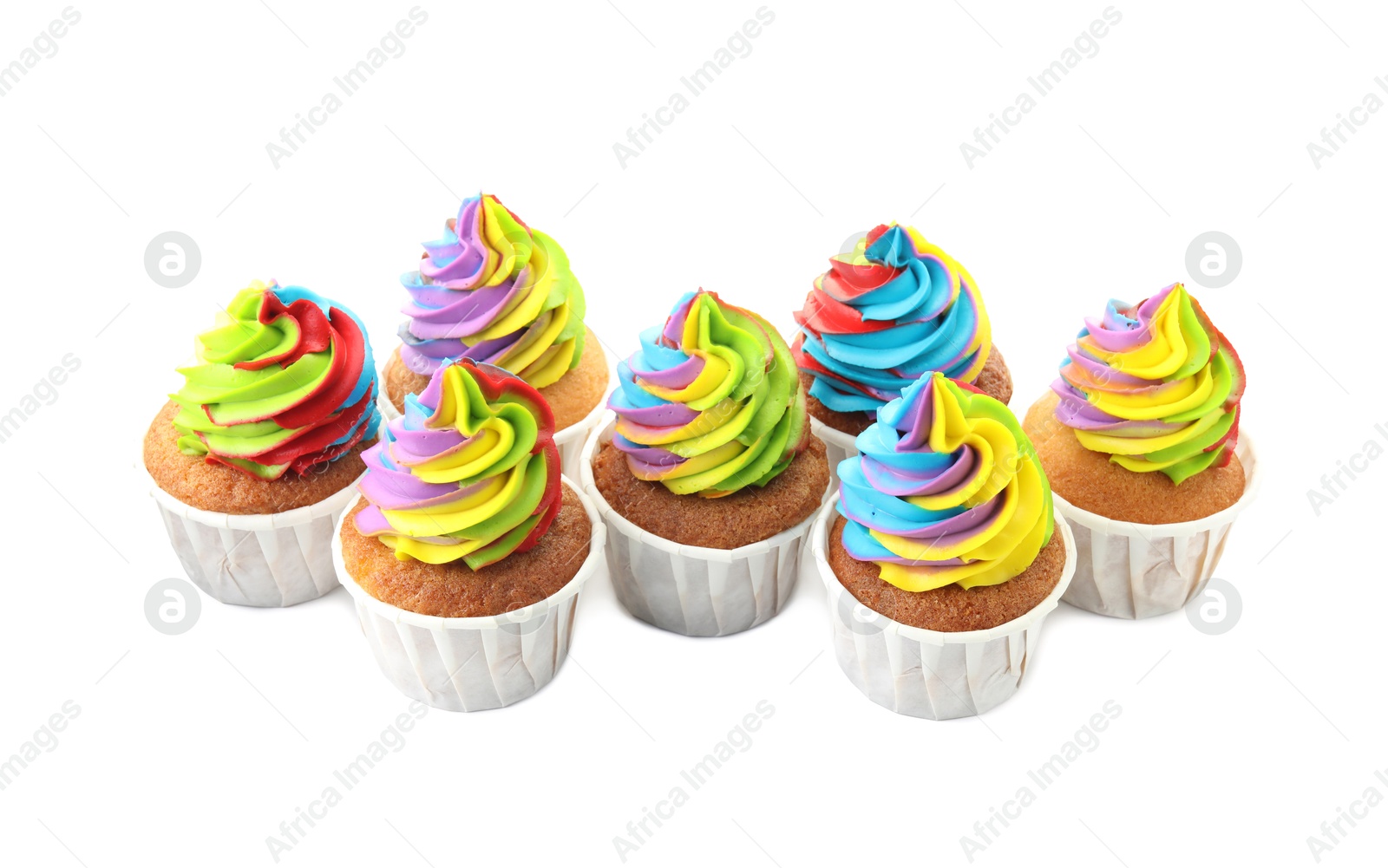 Photo of Tasty cupcakes with colorful cream isolated on white