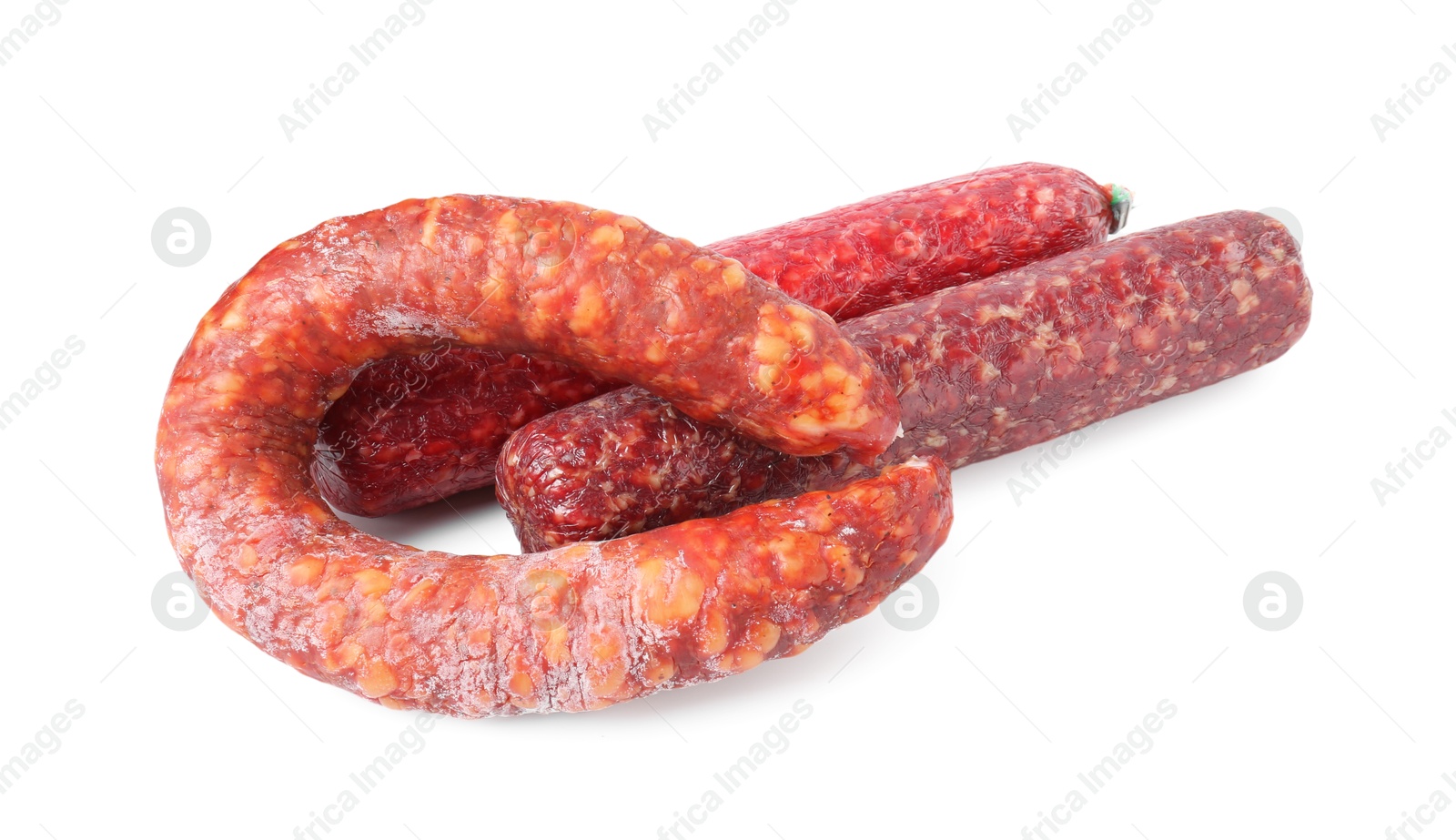 Photo of Many different smoked sausages isolated on white