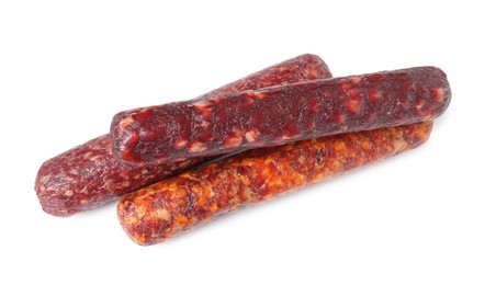 Photo of Many different dry cured sausages isolated on white