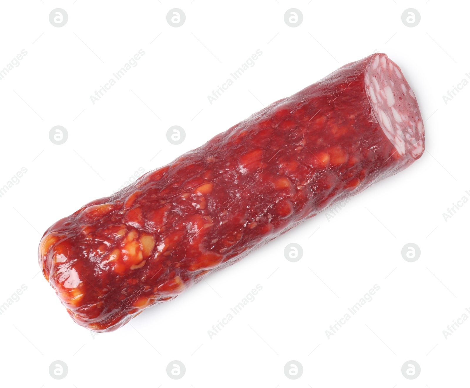 Photo of Piece of delicious dry cured sausage isolated on white, top view