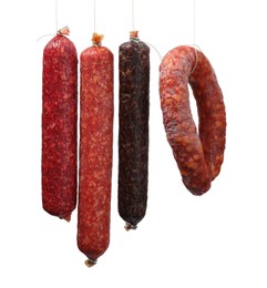 Photo of Many different smoked sausages isolated on white