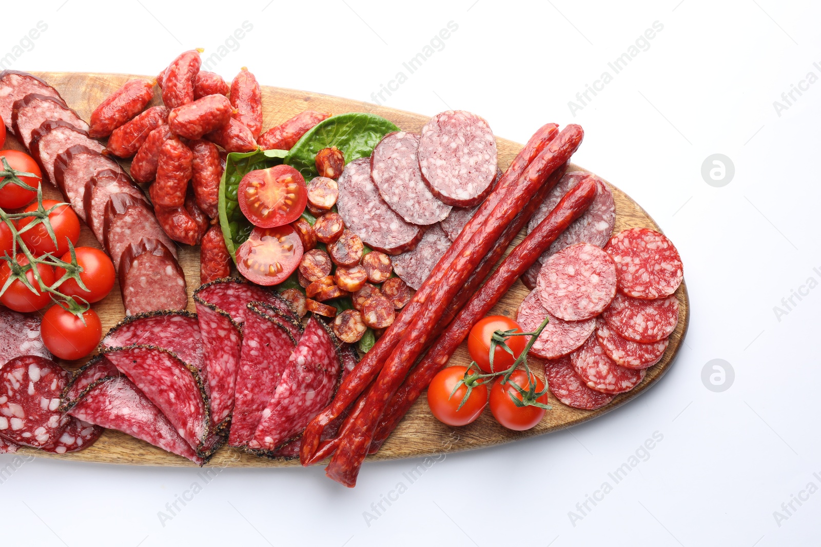 Photo of Different smoked sausages and other snacks on white background, top view