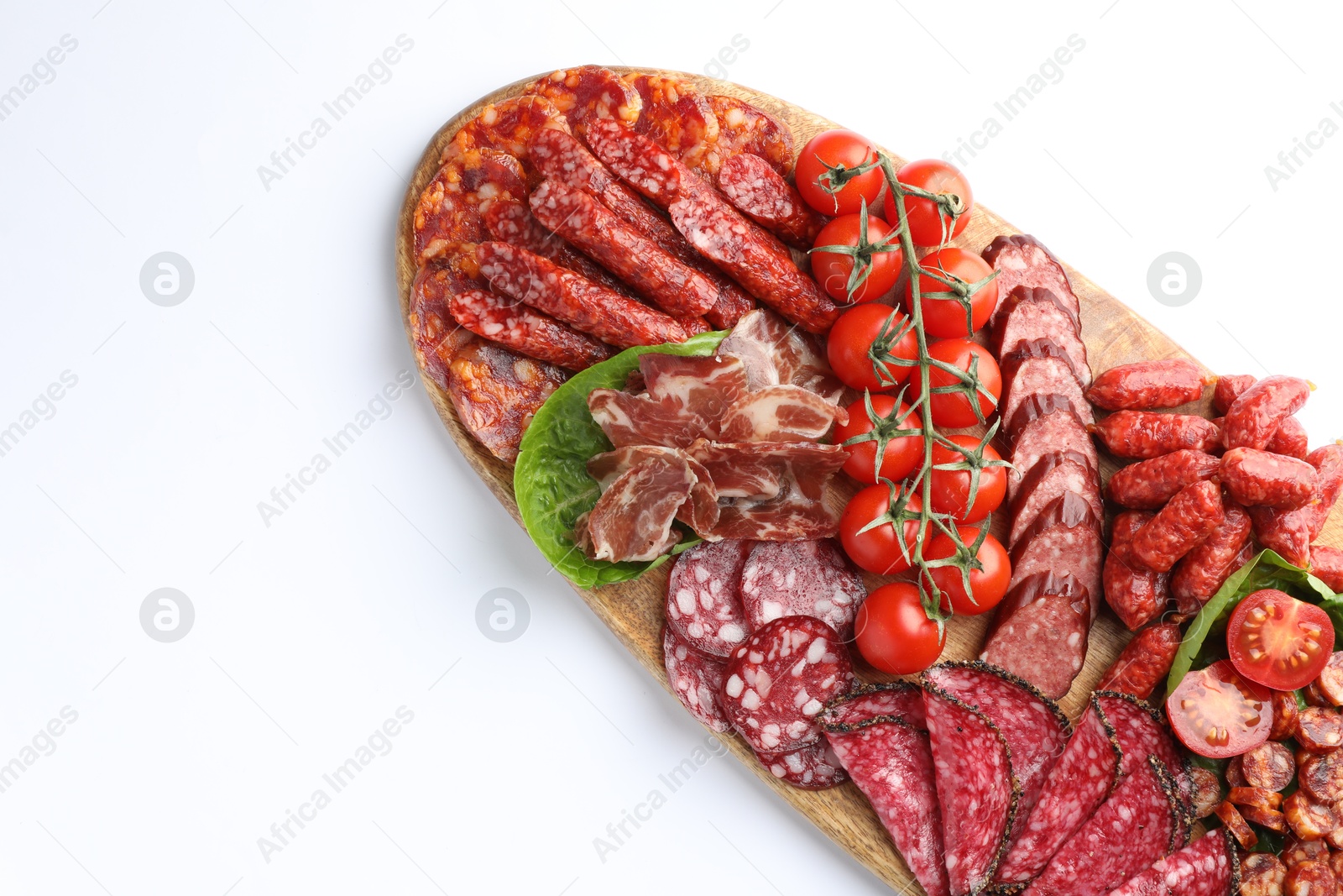 Photo of Different smoked sausages and other snacks on white background, top view