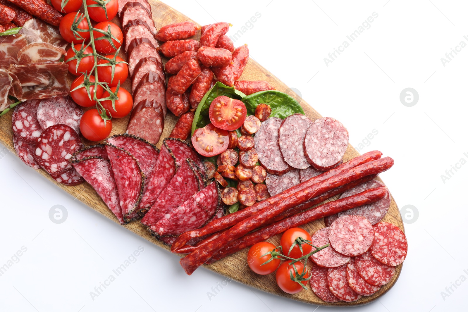 Photo of Different smoked sausages and other snacks on white background, top view