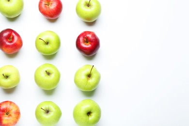 Red and green apples on white background, flat lay. Space for text