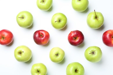 Photo of Red and green apples on white background, flat lay