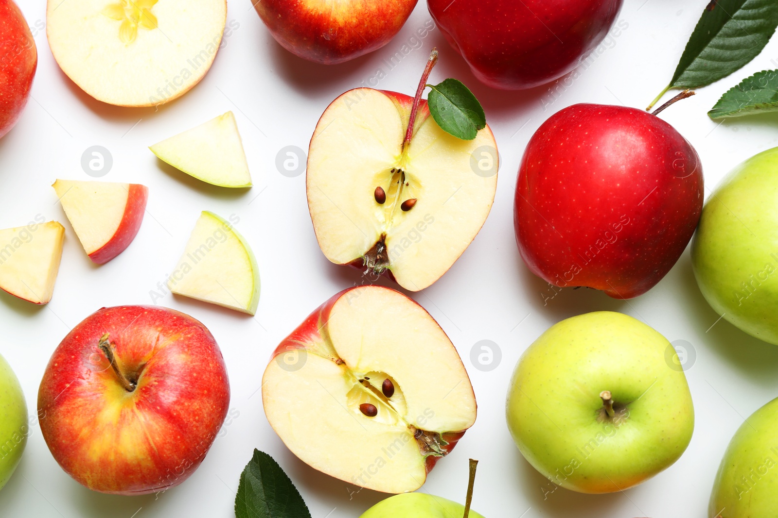 Flat lay composition with whole and cut apples on white background Photo of Flat lay composition with whole and cut apples on white background