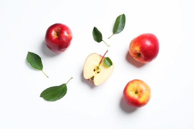 Flat lay composition with whole and cut apples on white background