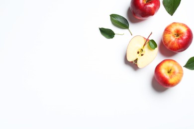 Photo of Flat lay composition with whole and cut apples on white background. Space for text