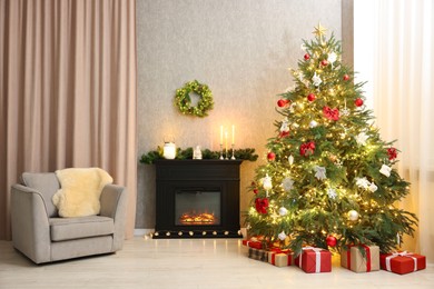 Photo of Cozy room with Christmas tree, fireplace and armchair. Interior design for holiday