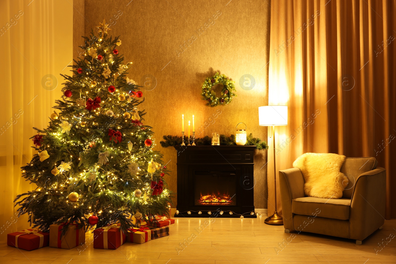 Photo of Cozy room with Christmas tree, fireplace and armchair. Interior design for holiday