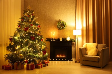 Photo of Cozy room with Christmas tree, fireplace and armchair. Interior design for holiday