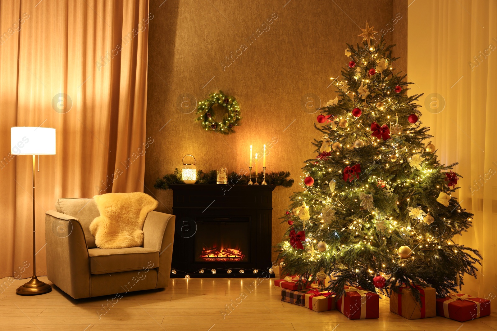 Photo of Cozy room with Christmas tree, fireplace and armchair. Interior design for holiday