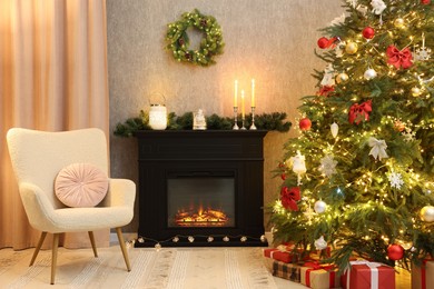 Photo of Cozy room with Christmas tree, fireplace and armchair. Interior design for holiday