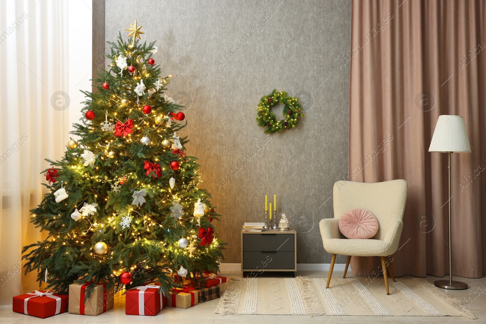 Photo of Cozy room with beautiful Christmas tree, armchair and lamp. Interior design for holiday