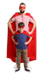 Photo of Father and his son wearing superhero costumes on white background