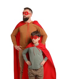 Photo of Father and his son wearing superhero costumes on white background