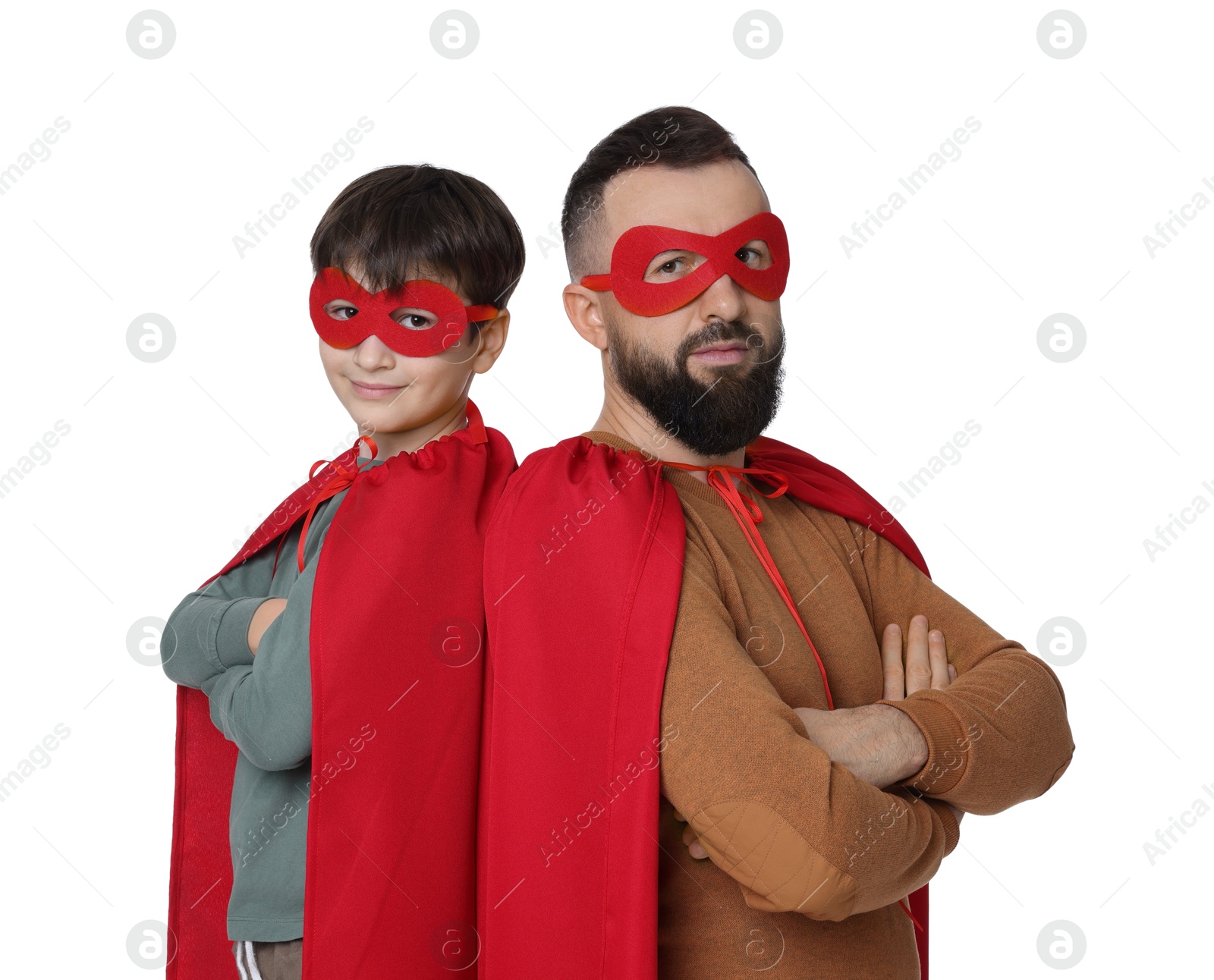 Photo of Father and his son wearing superhero costumes on white background