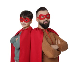 Photo of Father and his son wearing superhero costumes on white background