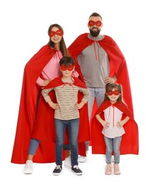 Photo of Parents and their children wearing superhero costumes on white background