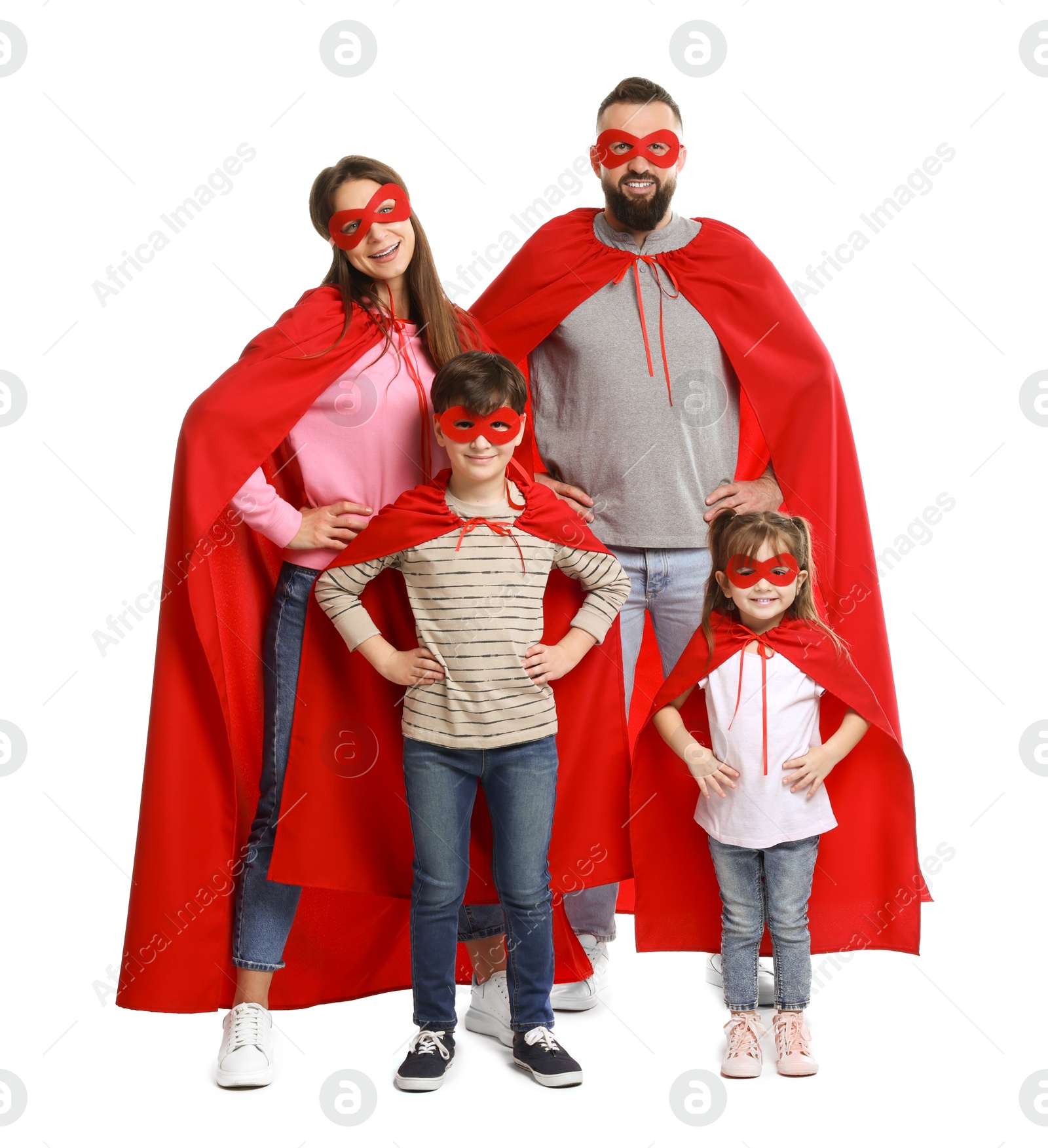 Photo of Parents and their children wearing superhero costumes on white background