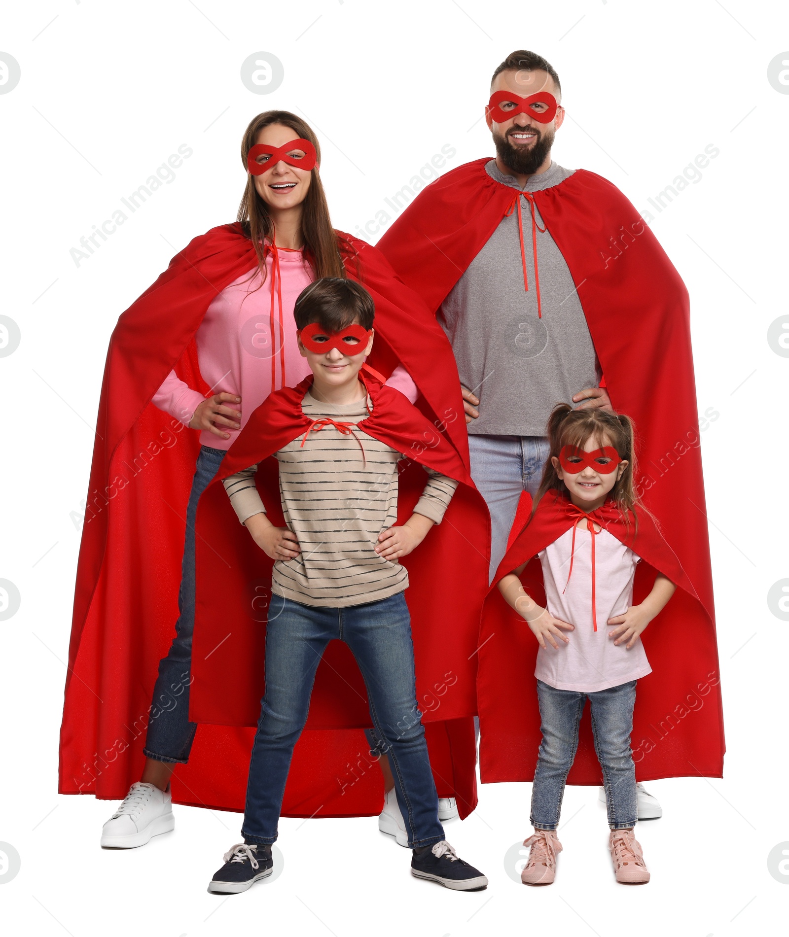 Photo of Parents and their children wearing superhero costumes on white background