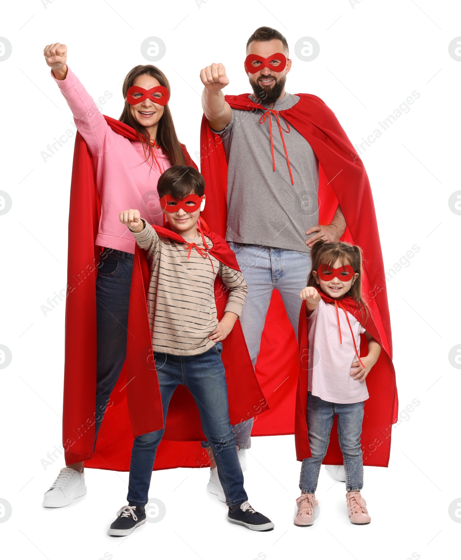 Photo of Parents and their children wearing superhero costumes on white background