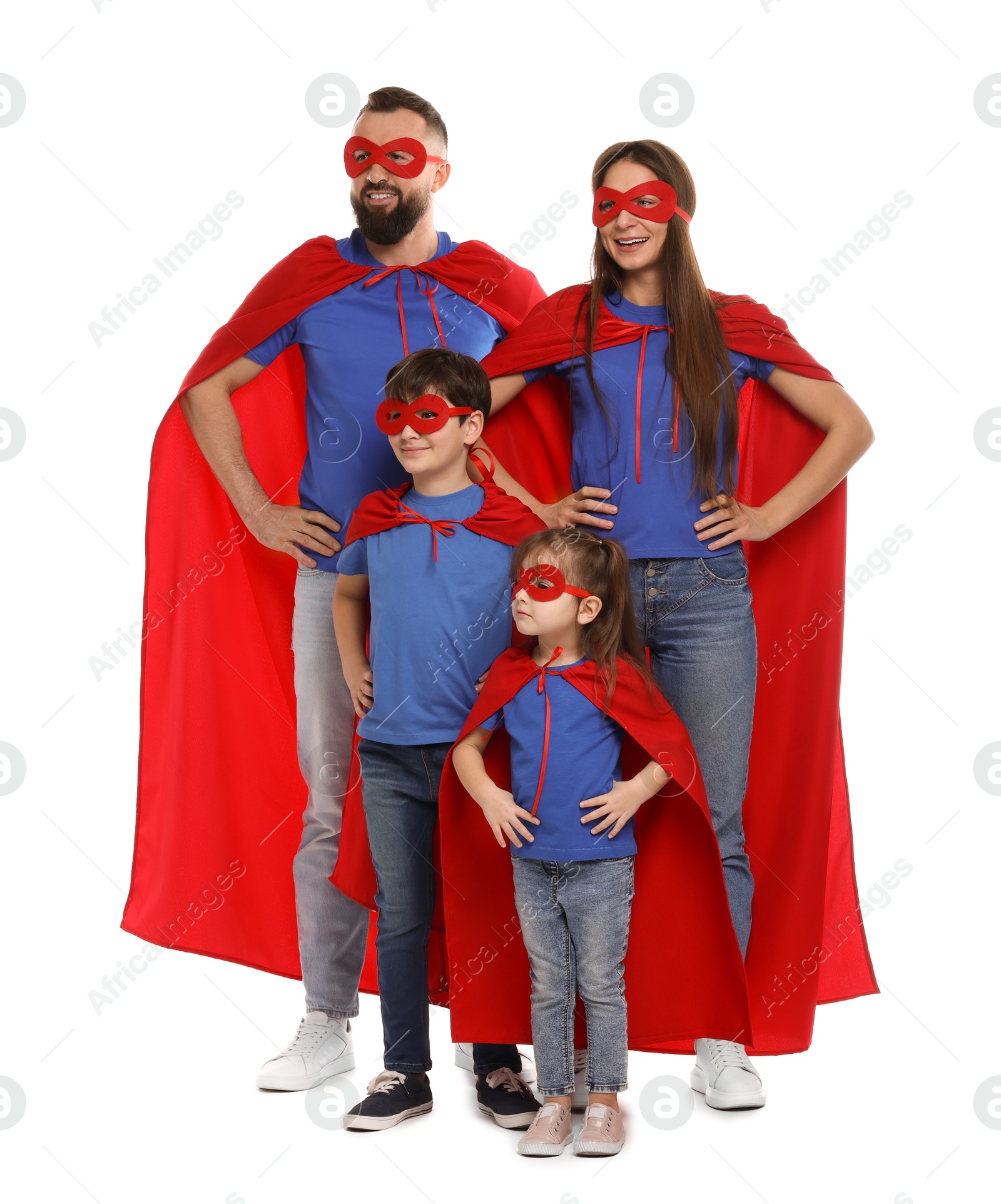 Photo of Parents and their children wearing superhero costumes on white background