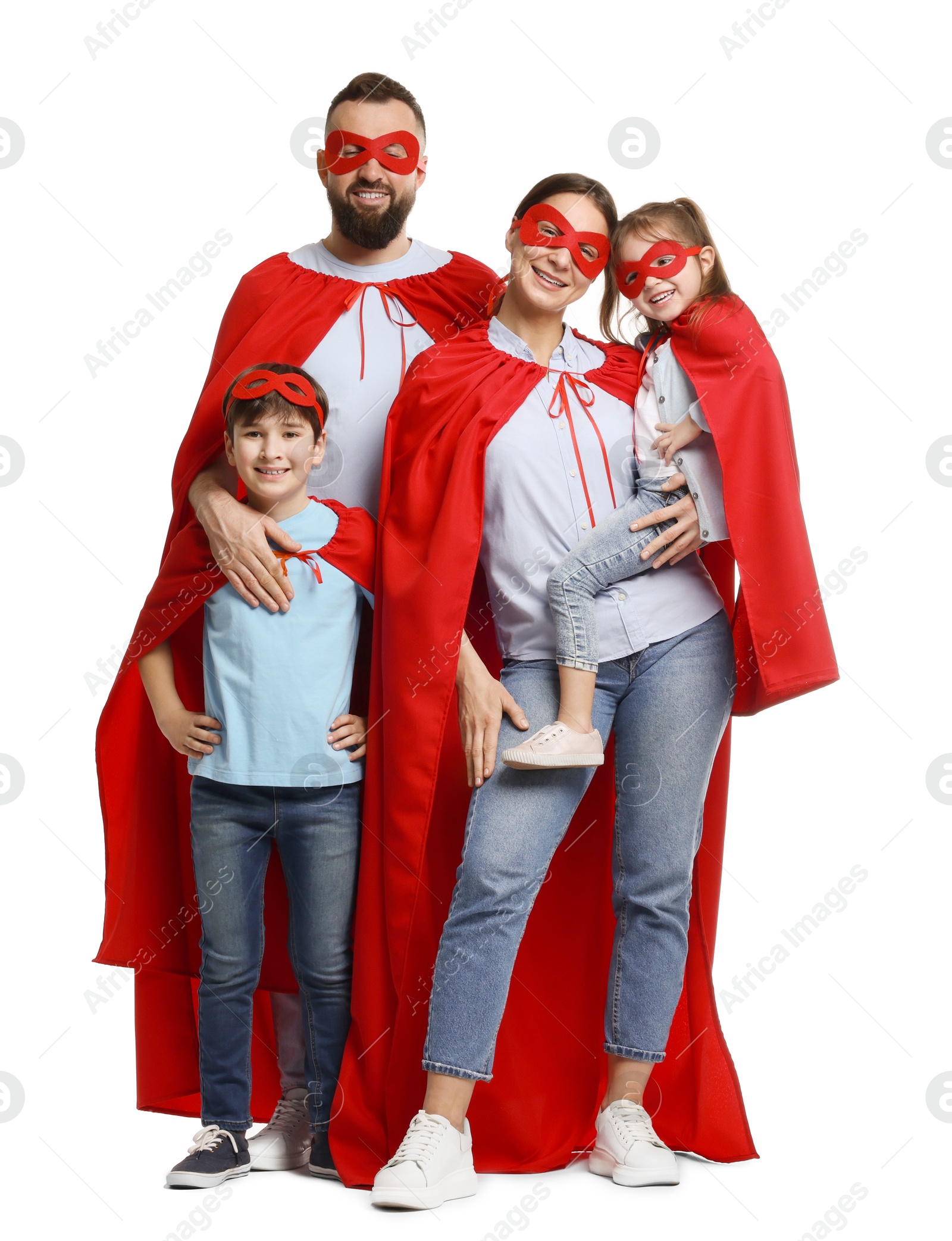 Photo of Parents and their children wearing superhero costumes on white background