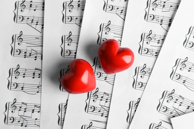 Photo of Heart figures on musical note sheets, top view