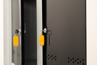 Photo of Modern lockers with bright keys indoors, closeup