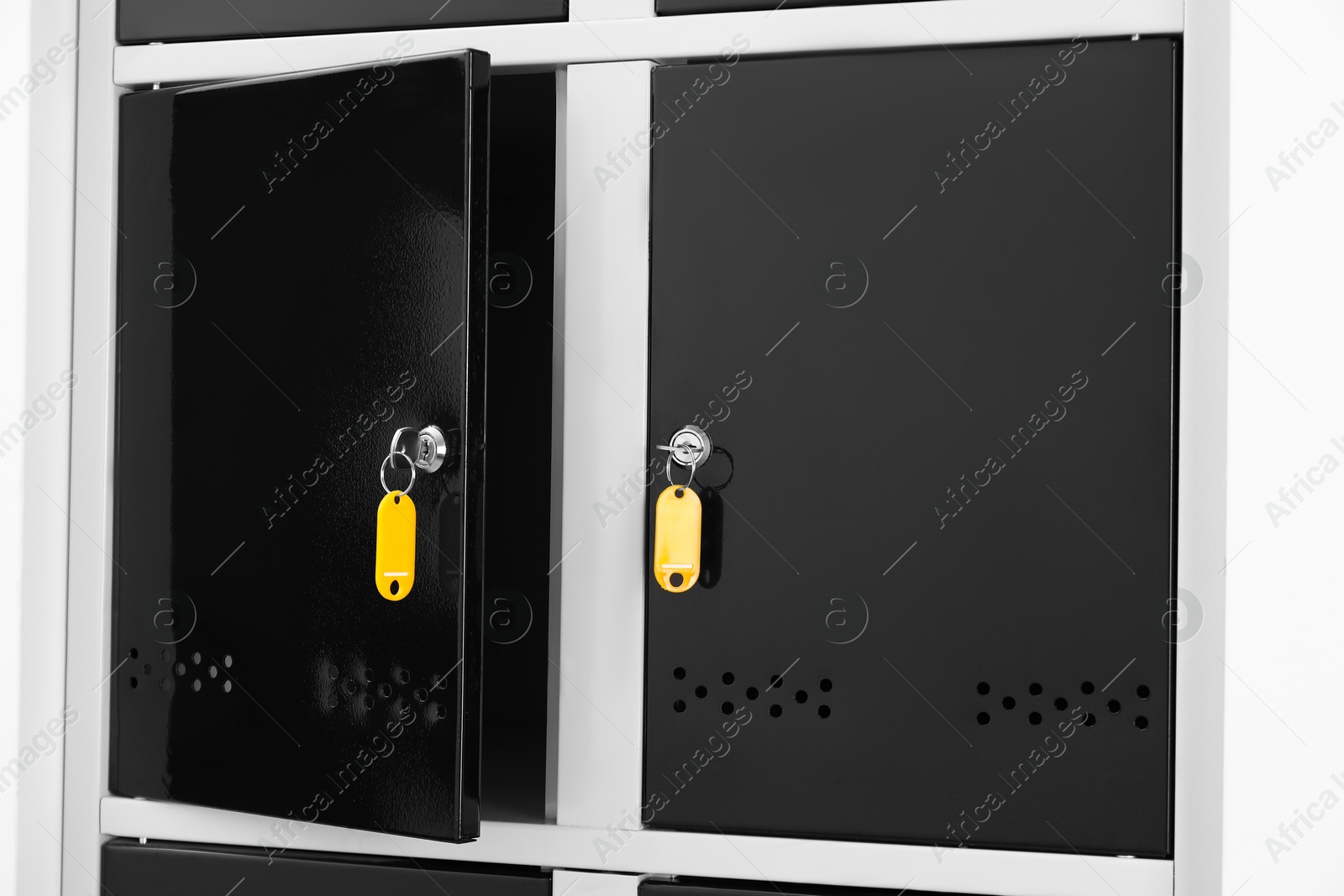 Photo of Modern lockers with bright keys indoors, closeup