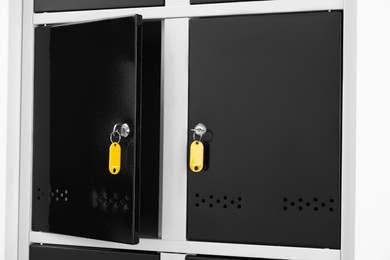 Photo of Modern lockers with bright keys indoors, closeup