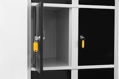 Photo of Modern lockers with bright keys indoors, closeup