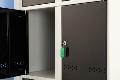 Photo of Modern lockers with bright key, closeup view