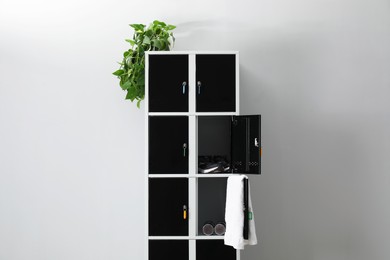 Photo of Lockers with personal belongings in changing room at gym