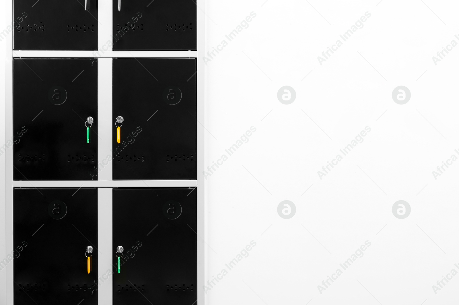 Photo of Locker with keys on light background. Space for text