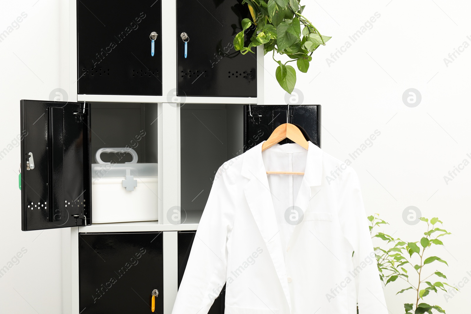 Photo of Medical personnel uniform on locker in changing room