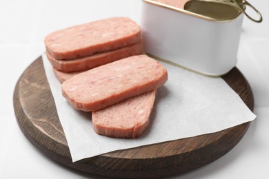 Photo of Tasty canned meat on white table, closeup