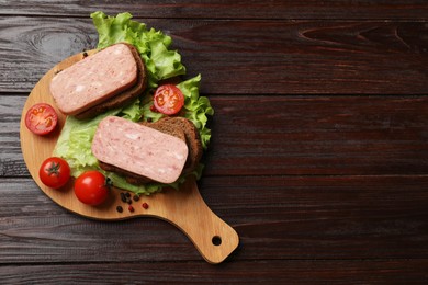 Tasty canned meat, bread, tomatoes, spices and lettuce on wooden table, top view. Space for text