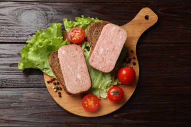 Photo of Tasty canned meat, bread, tomatoes, spices and lettuce on wooden table, top view