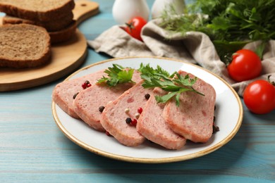 Photo of Tasty canned meat, spices, bread and tomatoes on light blue wooden table, closeup