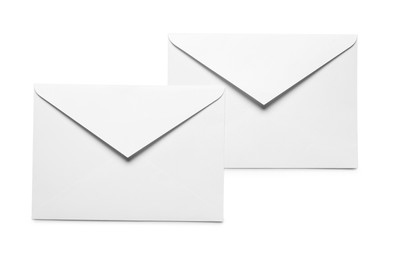 Photo of Envelopes isolated on white, top view. Mockup for design