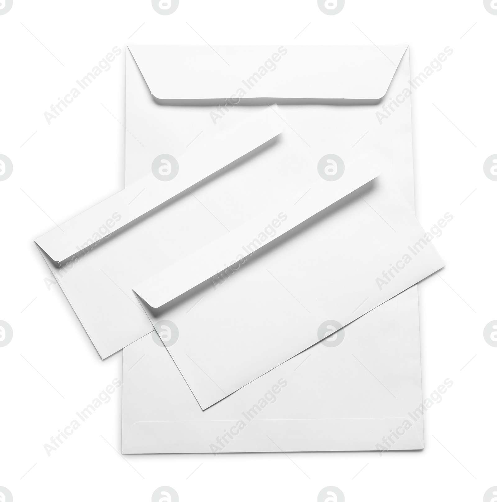 Photo of Envelopes isolated on white, top view. Mockup for design