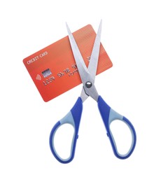 Photo of Credit card and scissors isolated on white