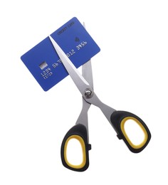 Photo of Credit card and scissors isolated on white