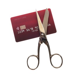 Photo of Credit card and scissors isolated on white