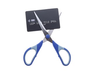 Photo of Credit card and scissors isolated on white